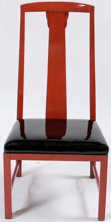 Set of six Asian form side chairs by Baker, finished in a cinnabar red lacquer. Seats upholstered in black patent leather.