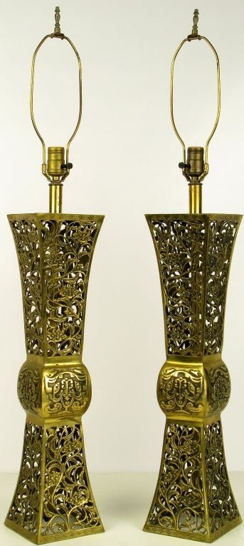 Stunning pair of large Asian form table lamps that are breath taking from every vantage point. Open cast filigree bodies.