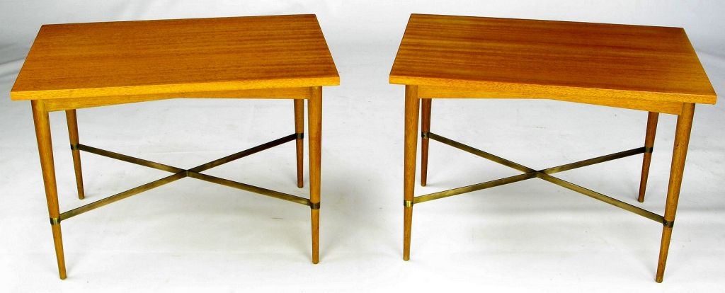 This pair of Paul McCobb side tables look as though they came out a time capsule. Excellent original finish and a wonderful patina to the brass X stretcher. The Connoisseur collection is one of the rarest of the Paul McCobb groups, manufactured by