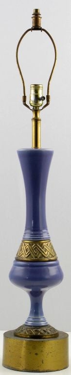 Statuesque table lamp,the body is a combination of brass and  amethyst, leaning to periwinkle blue, glazed ceramic. The base has the original patina. Shade is for display only.