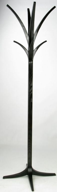 Art deco coat stand, or hall tree, with cast iron base that seamlessly blends with the black oak 