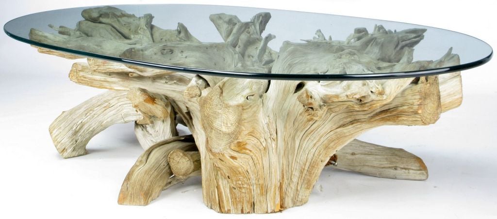 A sculptural driftwood coffee table in a natural, weathered finish. Nice full base and 5/8