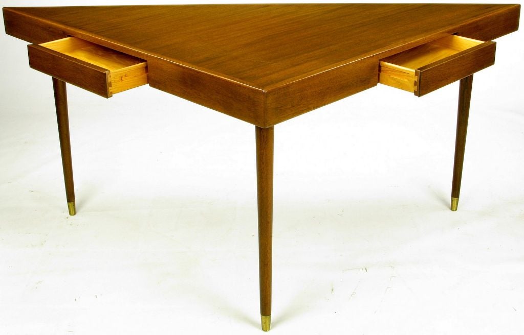 A brilliantly simple design from Harvey Probber. This sofa table would also work exceedingly well as a writing table, desk, or, as a flat screen T.V. stand. Two flush drawers and an exquisitely grained walnut top. The three widely spaced tapered
