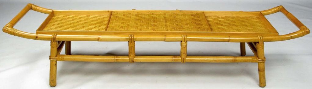 Alluring coffee table in bamboo with pagoda-form top and woven bamboo surface.  Integral matching tray.  Attributed to John Wisner for Ficks Reed.