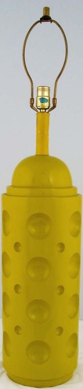 Canary yellow pop art table lamp in cast plaster with half spherical indentation. Sold sans shade.