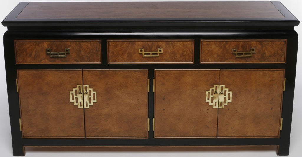 Inspired by Richard Nixon's diplomatic thaw with China, Century Furniture produced its Chin Hua Collection to great acclaim in the mid-1970s. Featuring a black lacquer case with burled top and drawer and door fronts, this sideboard cabinet or