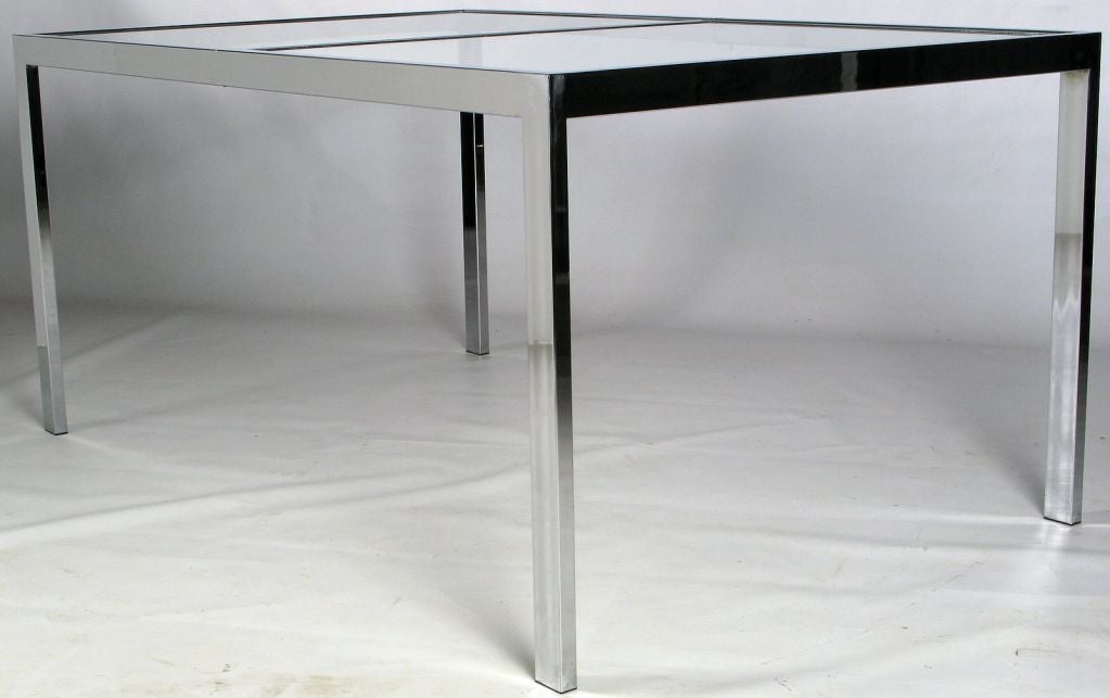 Classic chromed steel and glass parsons style dining table in the style of Milo Baughman for Thayer Coggin.