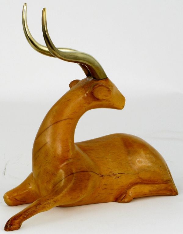 Unusual and refined Art Deco revival carved wood gazelle with brass antlers.