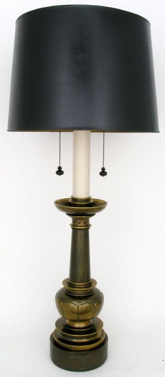 Very substantial pair of neoclassical baluster form antiqued brass table lamps by Stiffel. Greek key design on base.  The double sockets are supported by a large candle style upright. Sold sans shades