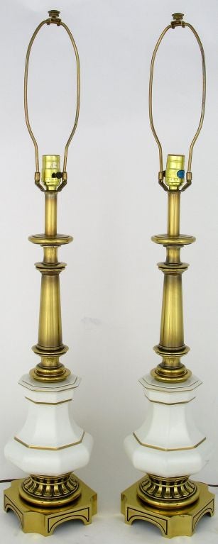 Two vintage Stiffel table lamps, with brass bases and columns, and octagonal urn-form white porcelain bodies.  Gilt trim to white porcelain.  Sold sans shades