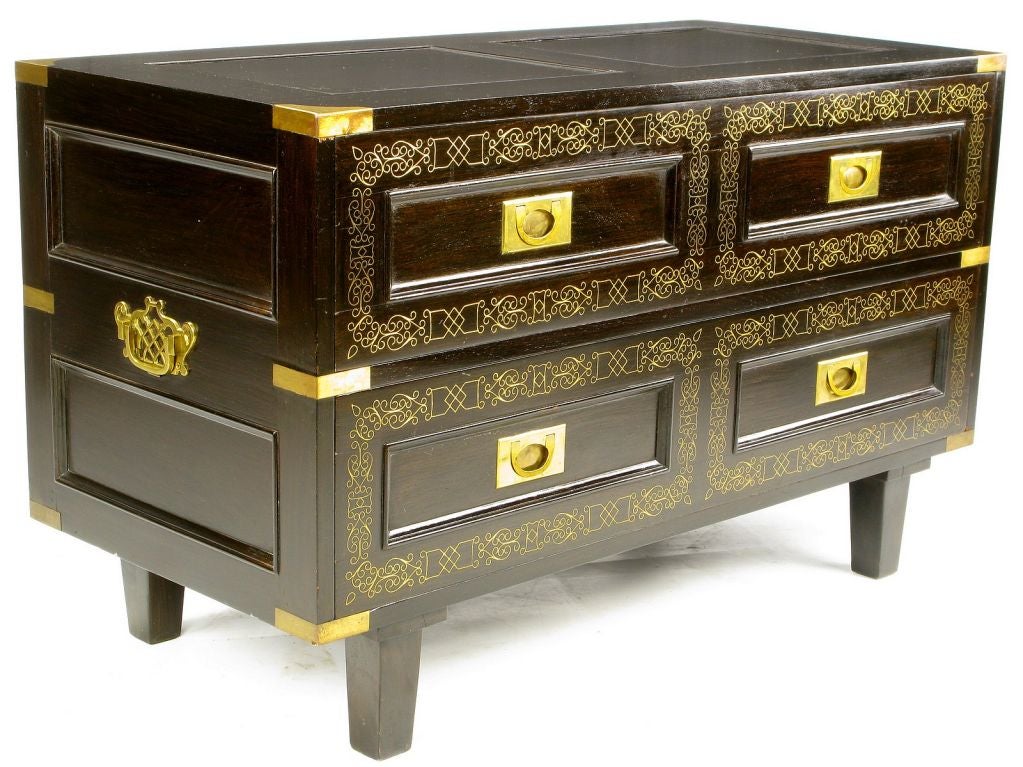 A fine unmatched pair of low campaign chests, featuring brass corners and strapping, flush campaign style pulls, and brass handles on each end.  One has eight drawers, and the other has four. <br />
<br />
Finished on all four sides, so can be