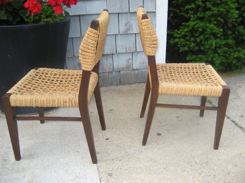 Beautiful set of four side chairs by Audoux-Minet by VIBO....wood frames wrapped with braided rope seats and backs....