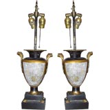 A pair of antique tole urns later mounted as lamps