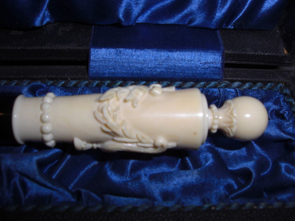 A great quality caved ivory and ebony conductor's baton with an engraved dedication 