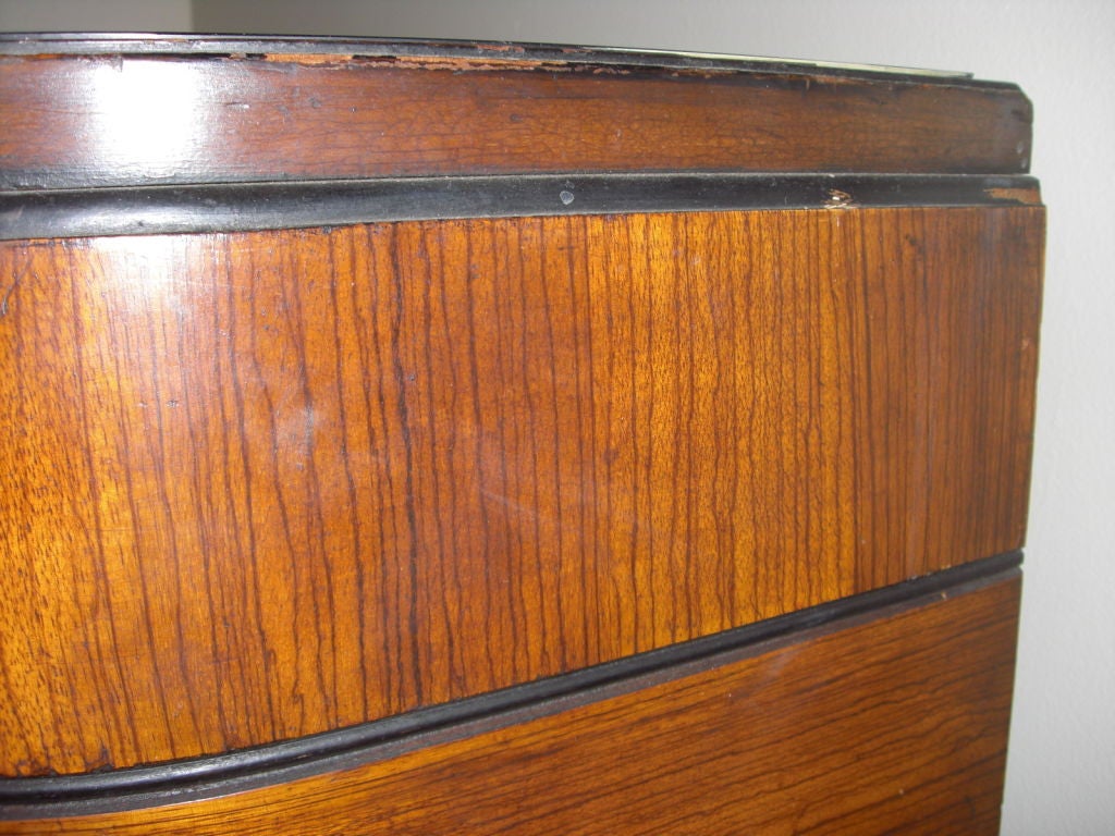 A 1940's bow-front chest of Drawers by laurence Emmons Inc. 1