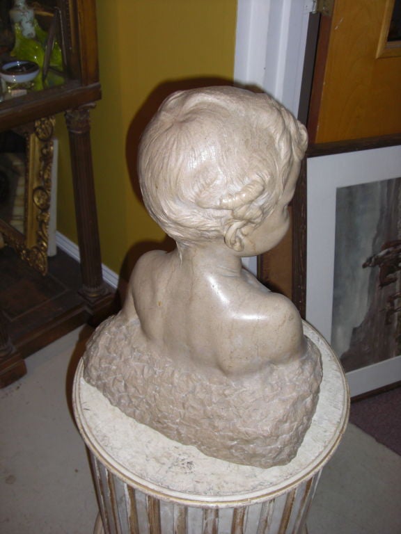 20th Century carved stone bust of a young boy signed Max blondat