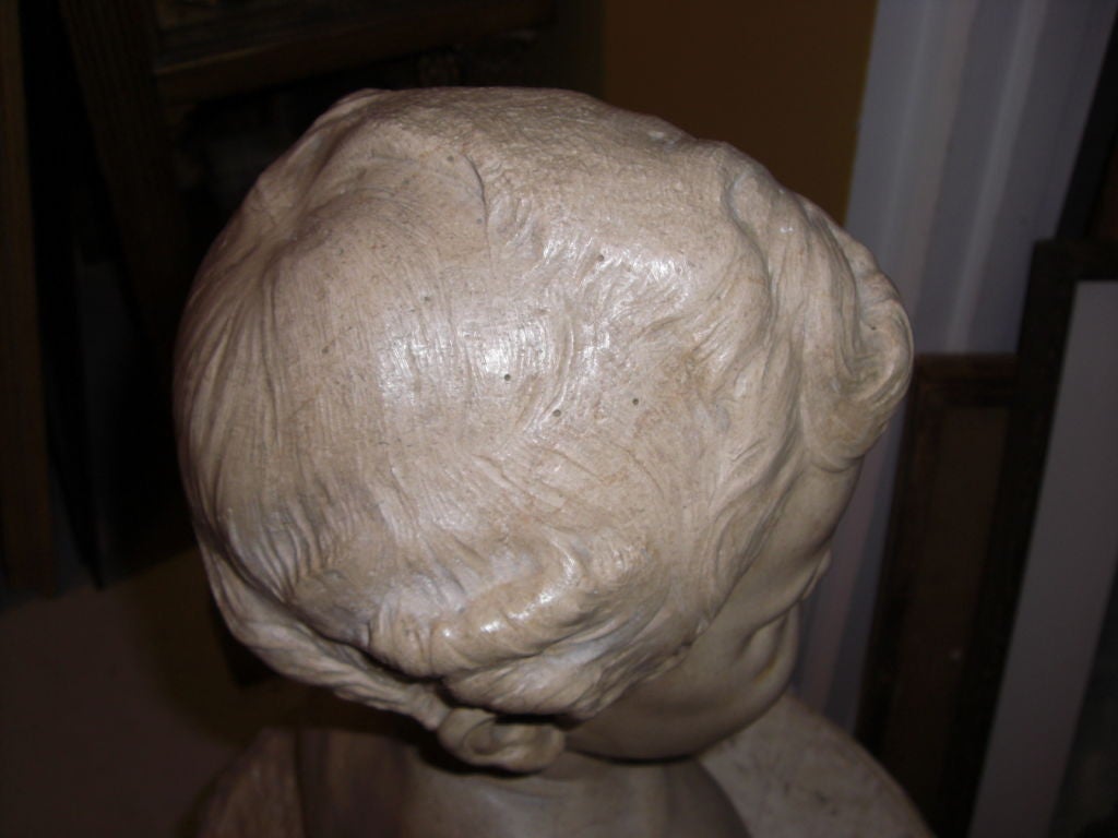 carved stone bust of a young boy signed Max blondat 1