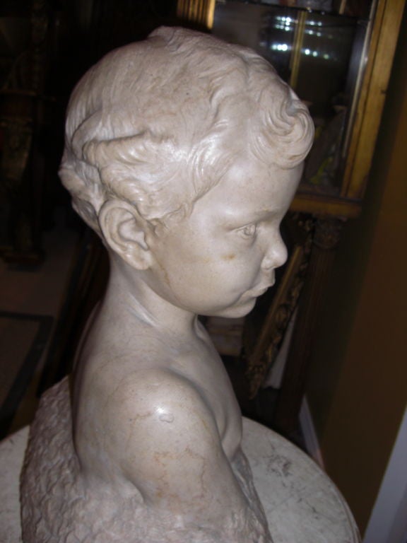 Stone carved stone bust of a young boy signed Max blondat