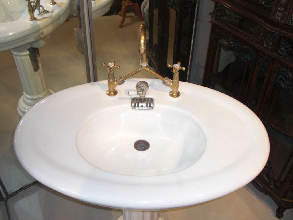 A very nice quality two-part porcelain sink with brass and nickel plate hardware.