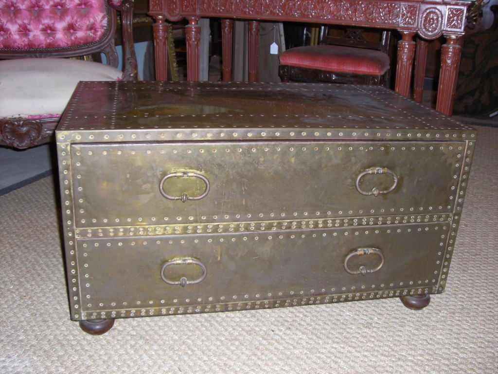 Brass covered two-drawer chest/coffee table with copper nails and ball feet manufactured in Spain by 