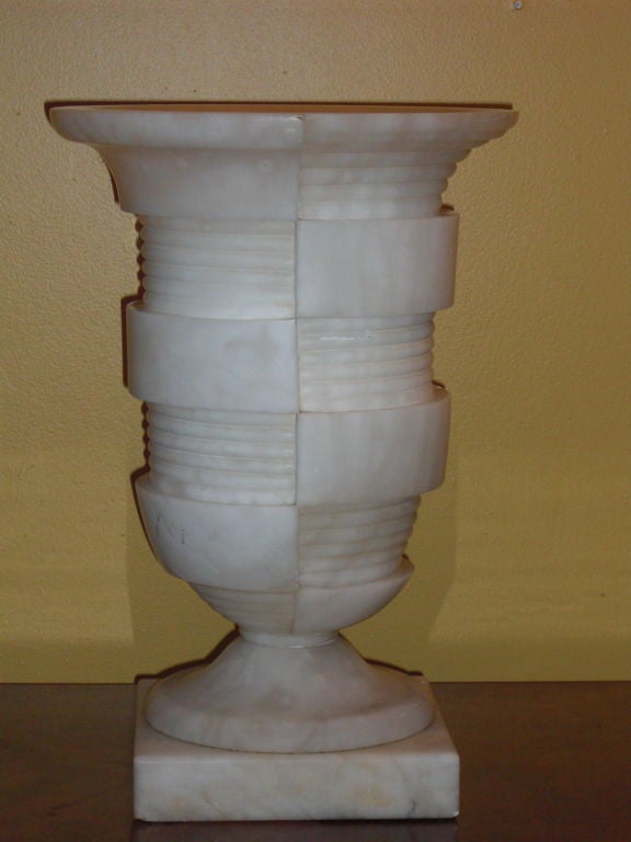 A wonderful asymetrical Art deco white alabaster urn lamp circa 1930. We have had many alabaster lamps but have never seen one of this type of design.Very Frank Lloyd Wright looking.
