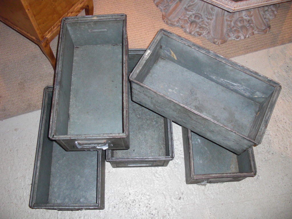 5 mid-20th century industrial galvanized aluminum bins. There are many of these types of industrial bins around but these are particularly well made and heavy . They can be used for storage, planters etc...  priced individually.