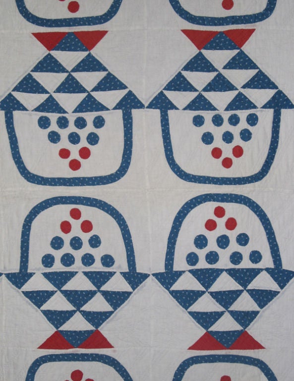Applique and pieced calicos and solids on white ground with  excellent quilting in straight line and leaf motifs.  A playful variation on a traditional pattern.