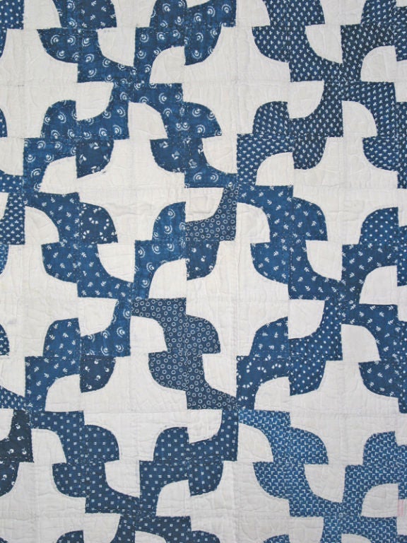 Indigo and white calicos were alway very popular in American quilts, and remain so today.  This remarkably well-made example contains a virtual library of the many calicos manufactured in the period. This is an intricate variation of