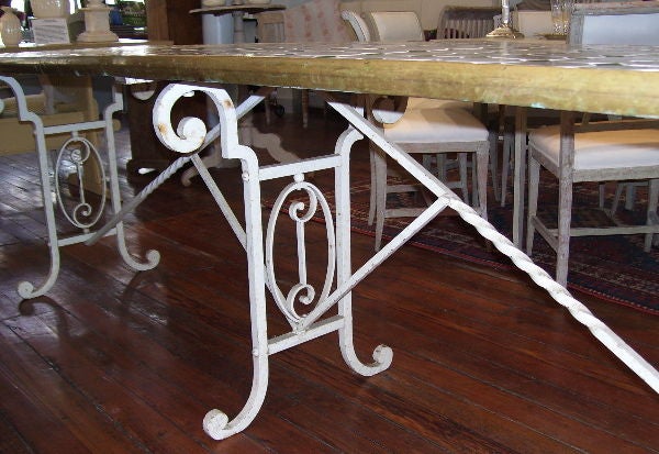 20th Century A French iron table with ceramic tile top.