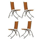 A Set of Four Iron & Leather Campaign Chairs