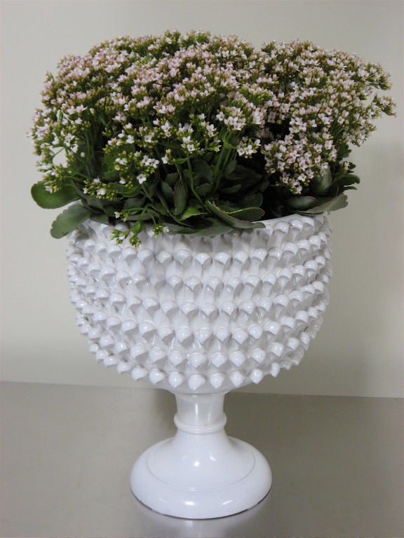 A large pedestal Italian Majolica Jardiniere<br />
in a pineapple form.<br />
<br />
Solid white ceramic with crackle glaze.<br />
<br />
Perfect for a large floral arrangement,<br />
or garden planter.