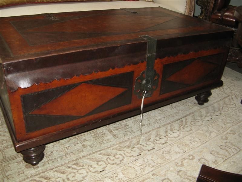Vintage Baker Furniture Leather Trunk C. 1960.  This handsome leather trunk or coffee table is both beautiful and functional.  It is great to store blankets.  It also serves as a table.  There is a 4