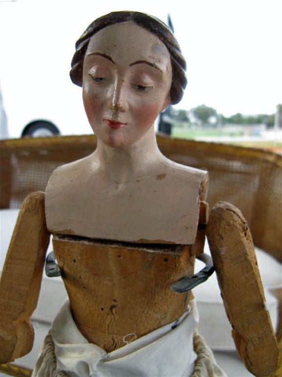 I found this treasure on one of my Italian adventures.  She has a lovely face with a serene expression.   The carved base comes with the doll.  She would be a great asset to any doll collection.