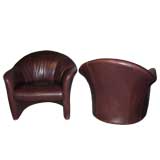 Pair of bordeaux colored leather chairs