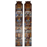 Pair of Painted Tin Totem Poles
