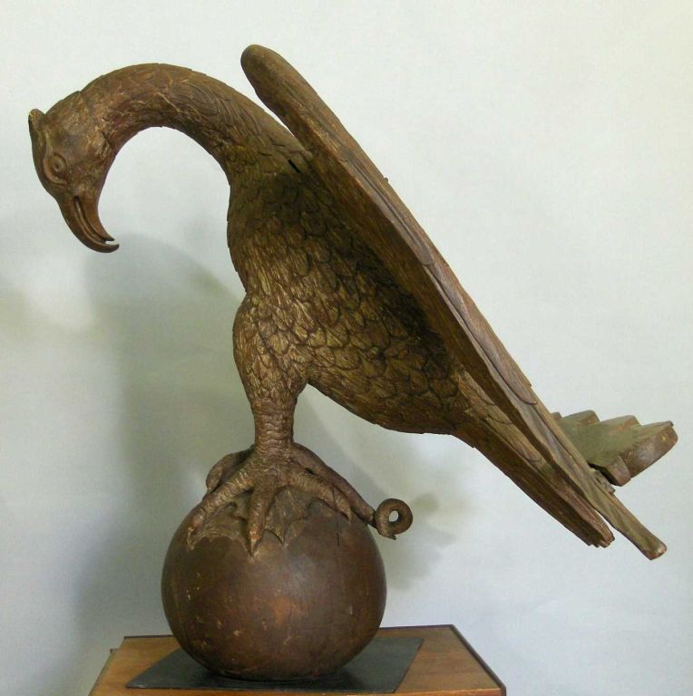 Once adorning the top of a lecturn, this 19th century bird of prey is provincial in manner but transcends into quite a presence. Finely carved with massive claws clutching a snake!