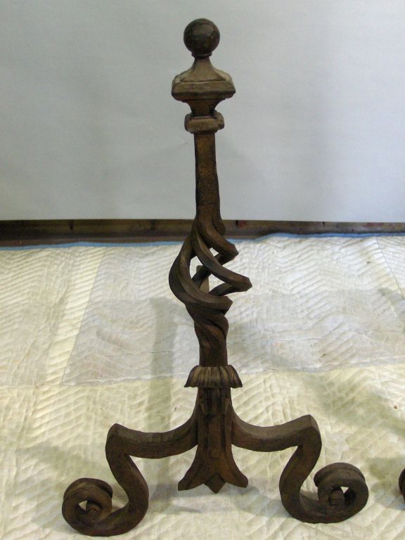 Heavy hand wrought andirons with great details and original cross-bar. Superior workmanship and terrific design make these a compliment to any fireplace!