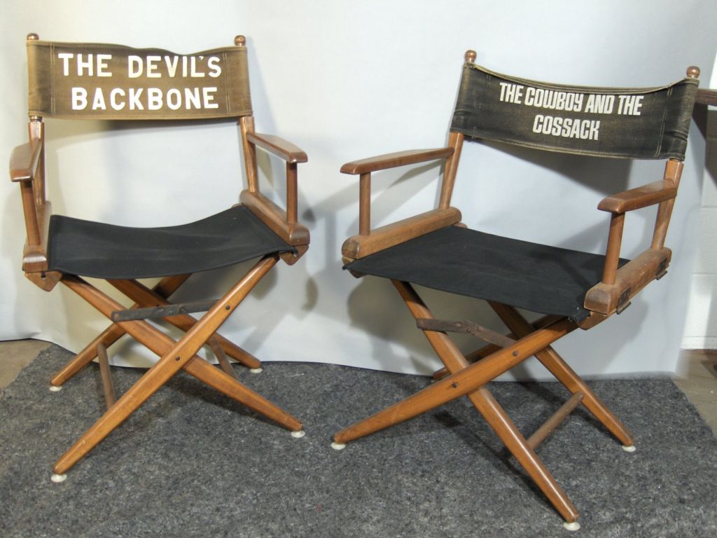 Old Hollywood comes alive with this set of director's chairs found in the attic of a Hollywood screenwriter. From the 1960's, these have old graphics on the vintage backrests, with newer seats and frames found in the basement. Priced per pair.