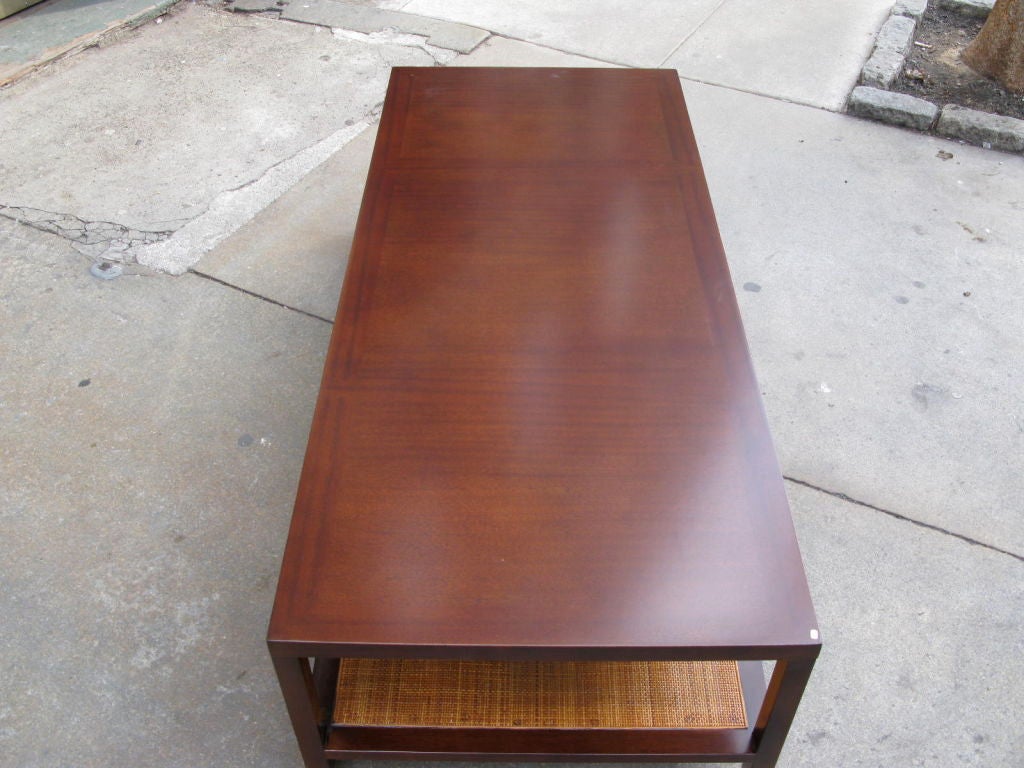 Walnut and cane coffee table by Harvey Probber