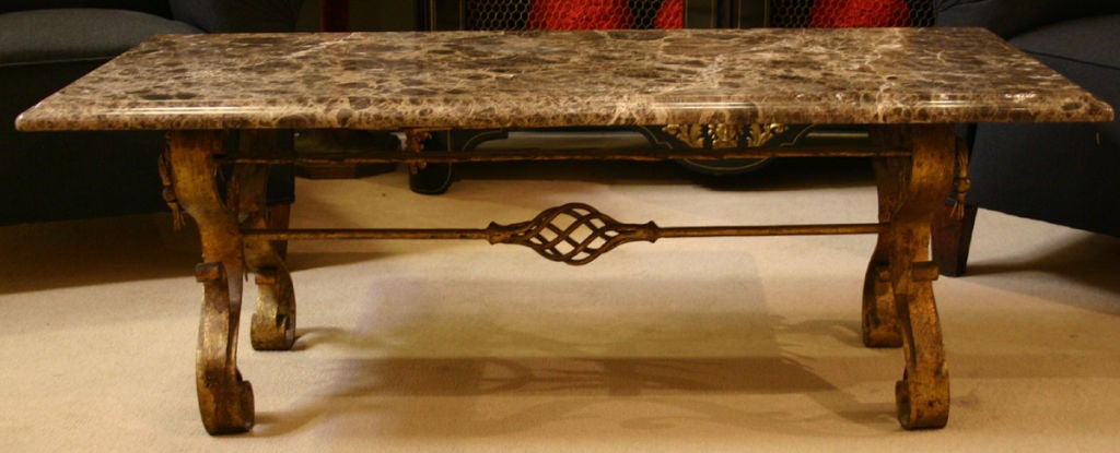A Moderne Gilt Iron Coffee Table Base with Later Marble Top