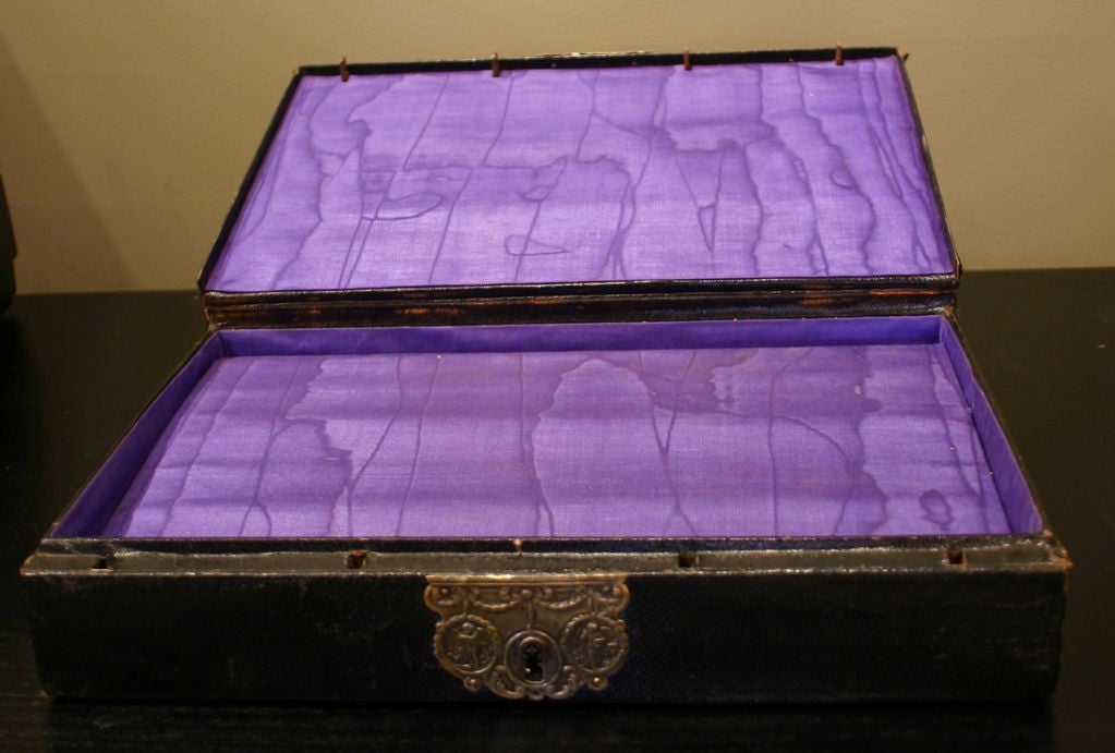 A Louis XVI Black Moroccon Leather Ecritoire