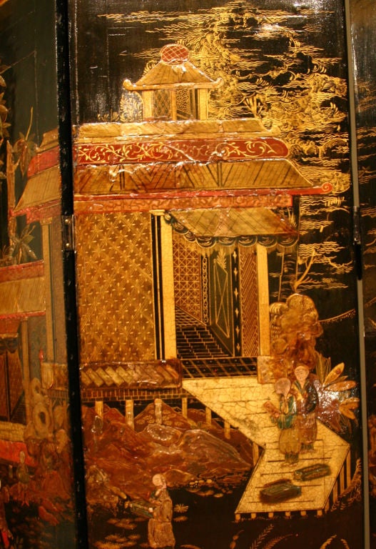 The wood screen decorated with black lacquer; depicting both aristocratic and rural scenes; including pagodas, court figures, peasants, boats and butterflies in gold and red lacquer; the reverse with black lacquer and a simple scene of marsh grass