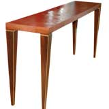 Console Table covered in Lizard with tapered wood legs with gold