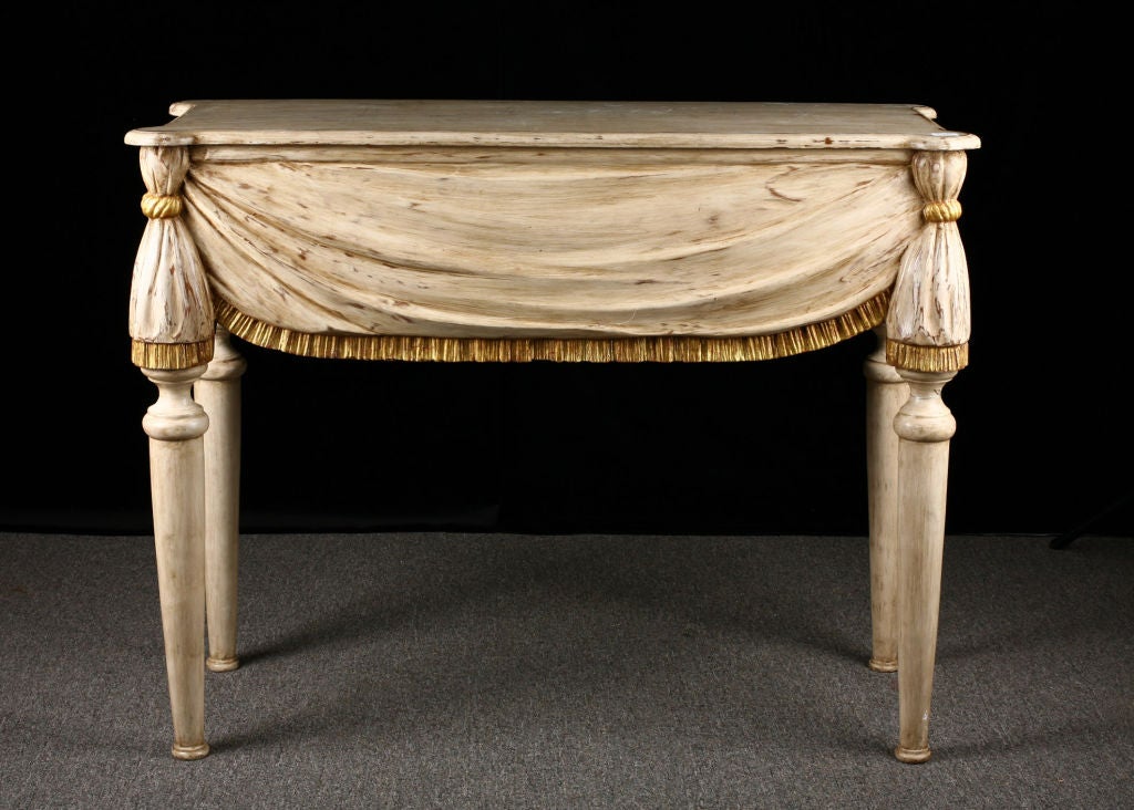 19th Century Italian console carved to look like a draped table with gold fringe and gathered at the corners.