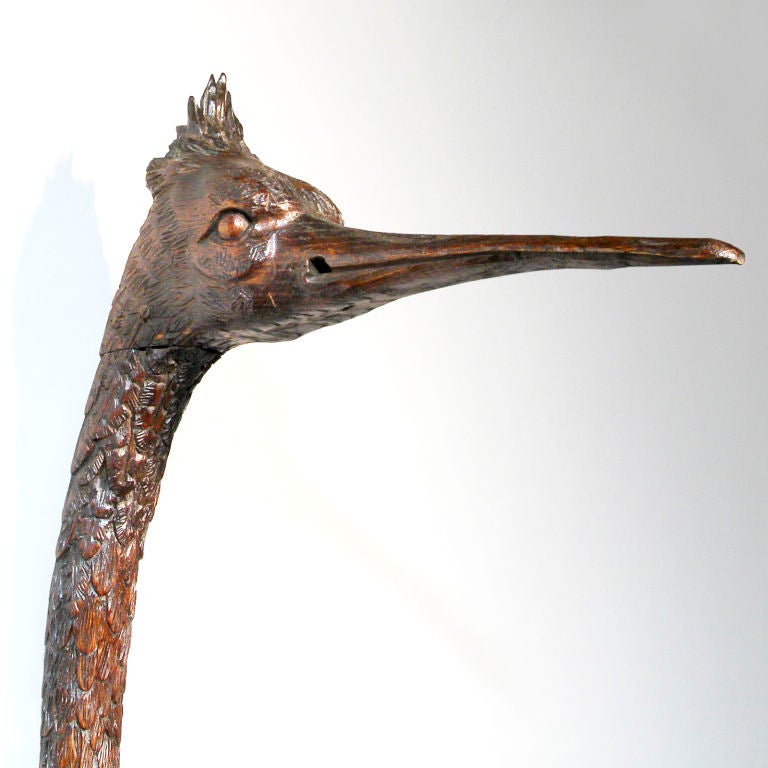 Finely detailed late 18th Century wood carving of a life-size pelican.  Intricately carved hardwood wall hanging showing the bird with wings spread and head aloft.