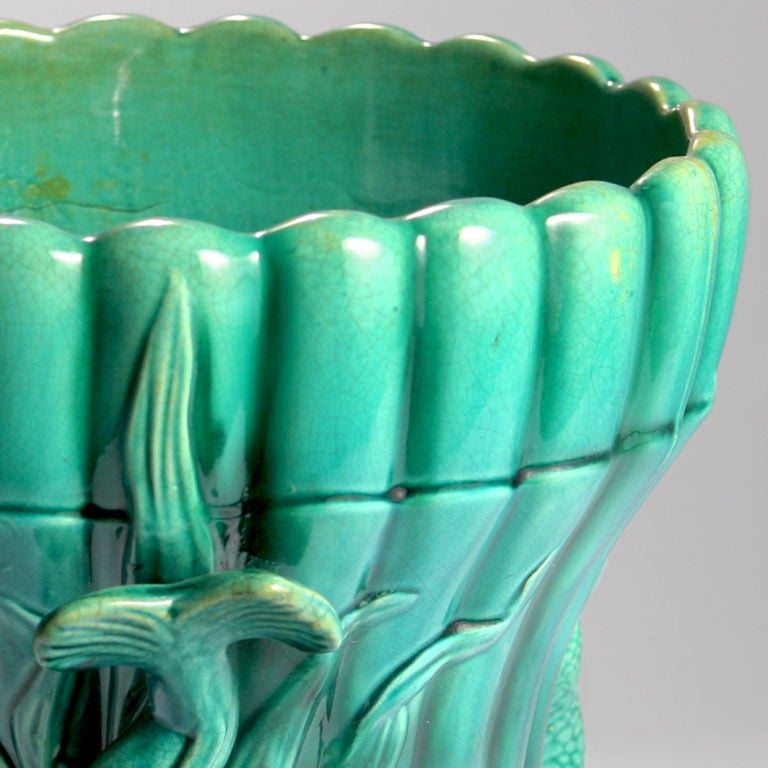 Graceful late 19th century English Majolica dolphin footed cache pot or garden pot with striking green-turquoise ground. Impressed: Wardle, England.