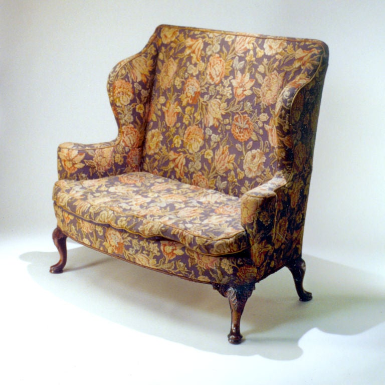 Wonderful pair of Victorian high-back settees with Queen Ann style legs on paw feet. Original upholstery.