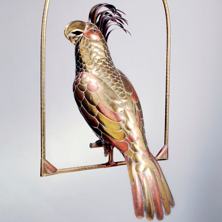 Large brass and copper SERGIO BUSTAMANTE folk art parrot on swing.  This Mexican artist established the 