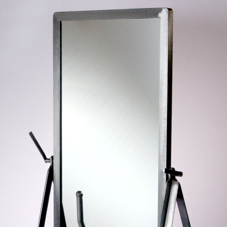 Ideal for a loft space, this one-of-a-kind Cheval-style mirror has polished steel components fashioned from 1950s medical equipment. Rolling base with trestle wheels and attached handle for moving.