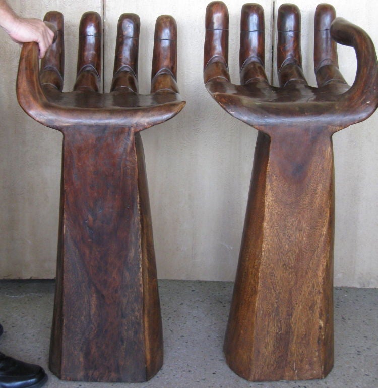 Wonderful Carved in shape of a hand, bar stools/(high chairs). Dense wood, fabulous patina, stable and comfortable. <br />
Feel free to call us with any questions at 305 562 2290 or go to our website: www. DanenbergAntiques.com for more pictures